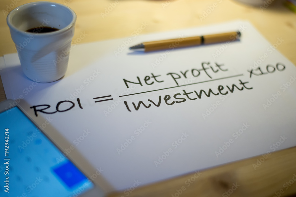 Return on investment statement on a white sheet of paper on a table during a business meeting Return on investment statement on a white sheet of paper on a table during a business meeting