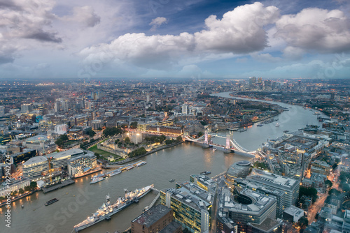 Aerial view of London Tower Bridge and skyline at night, London