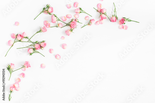 Flowers composition. Frame made of pink rose flowers on white wooden background. Flat lay  top view  copy space