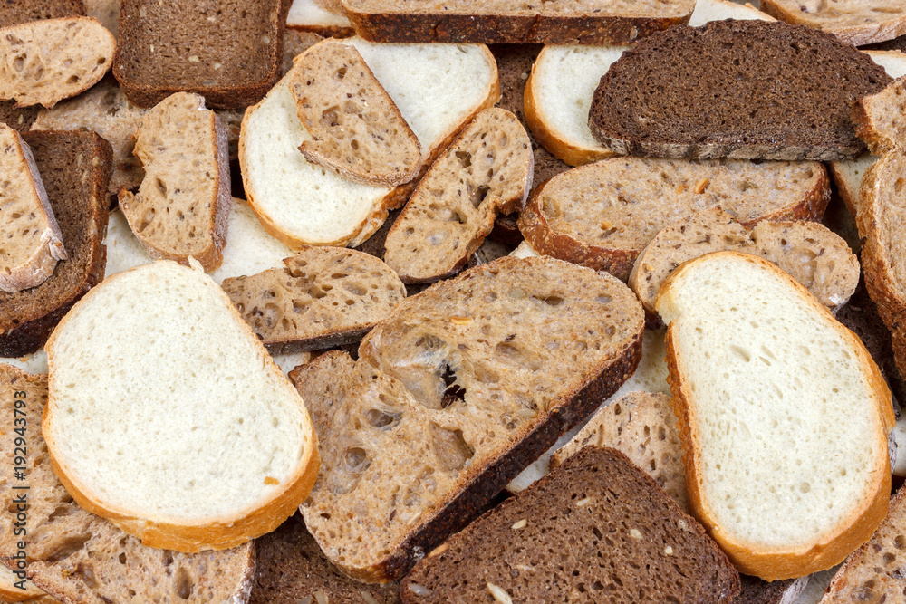 Sliced white and brown loaf of bread Sliced white and brown loaf of bread