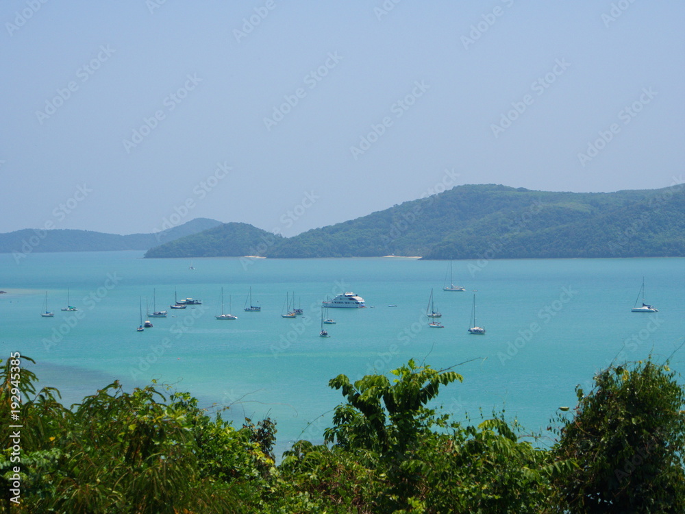 Phuket Coastline from the hill. A view of Andaman Sea with a boat and island.
