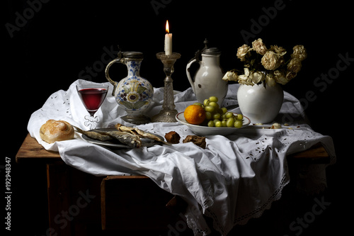 Classical Baroque Still-life in Dutch breakfast style on a black Background