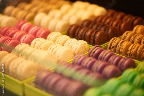A lot of beautiful colorful macaroons in candy shop