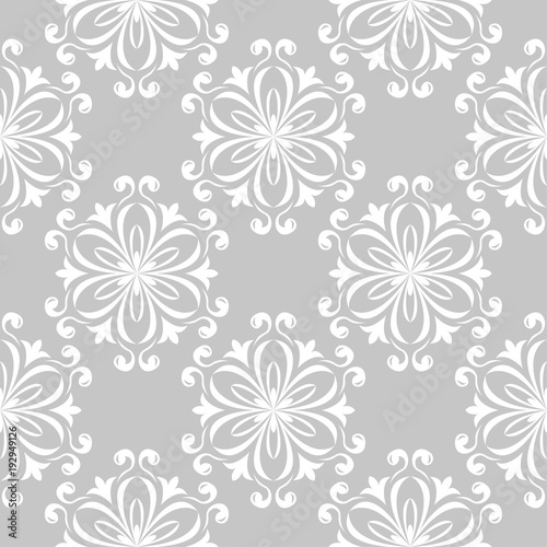 White floral seamless design on gray background