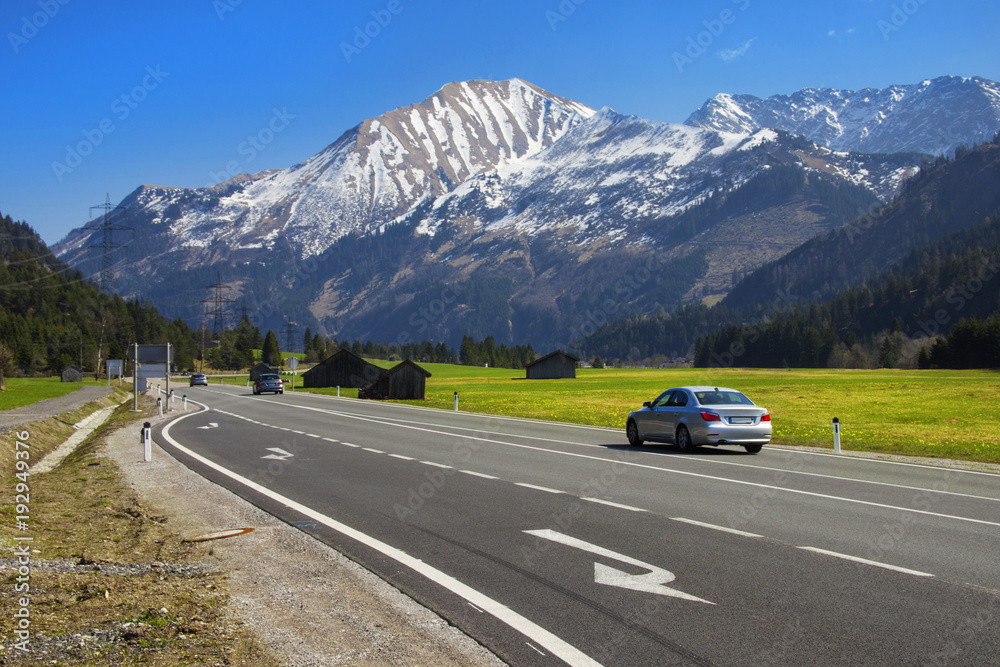 Fototapeta premium Austria. Alps, April. View of the highway in the Alps
