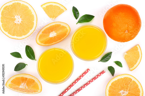 orange juice glass with slices of citrus and green leaves isolated on white background, top view. Flat lay pattern