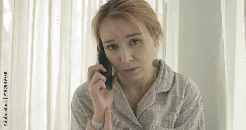 Beautiful woman talking on cellphone at home. Beautiful woman talking on cellphone at home.
