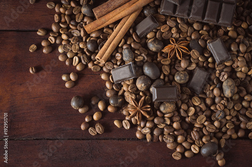 Dark Chocolate, Coffee Beans, Chocolate Balls, Spices, Cinnamon on the Old Wooden Table. Flat lay, top view