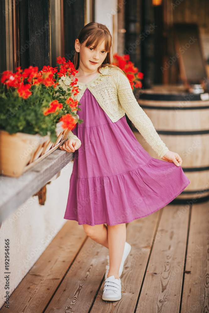 Adorable little kid resting in swiss Alps. Alpine style hotel, summer vacations in mountains Adorable little kid resting in swiss Alps. Alpine style hotel, summer vacations in mountains