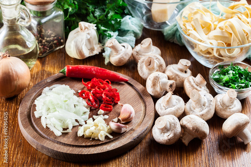 Ingredients ready for prepare tagliatelle pasta with champignon