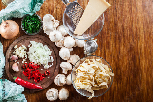 Ingredients ready for prepare tagliatelle pasta with champignon