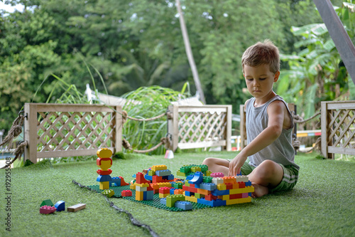 Wallpaper Mural Boy playing with plastic construction toys. Amusement playground. Thailand Torontodigital.ca