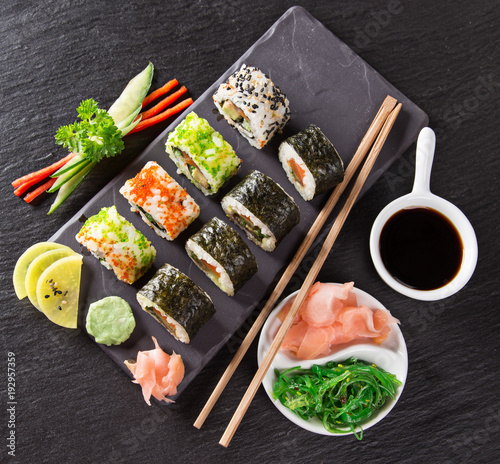 Japanese Sushi over black background.
