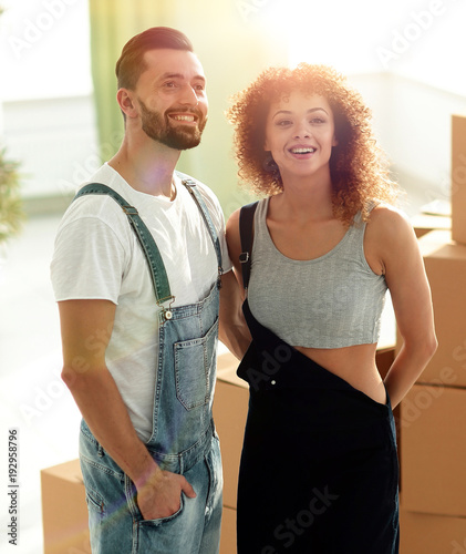 married couple standing in new apartment