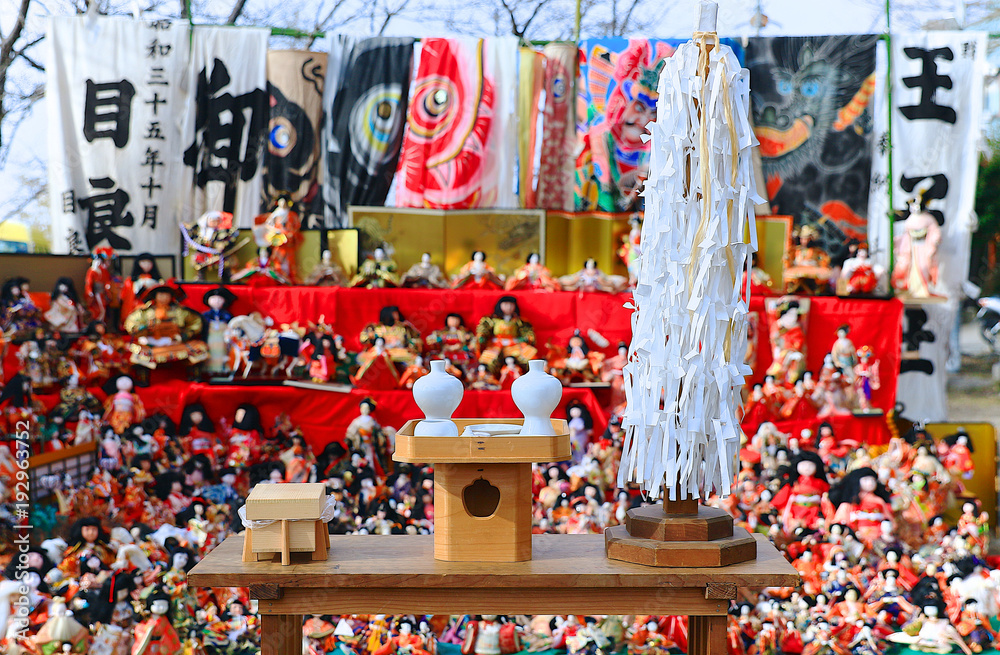 Japanese dolls & ritual articles set displaying on tiered stand during the Grand Bonfire Ceremony of farewell memorial service of old, used dolls at the Japan Shinto shrine Close up, Magnified image 4