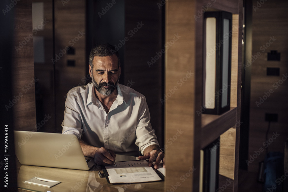 Fototapeta premium Businessman Working Late
