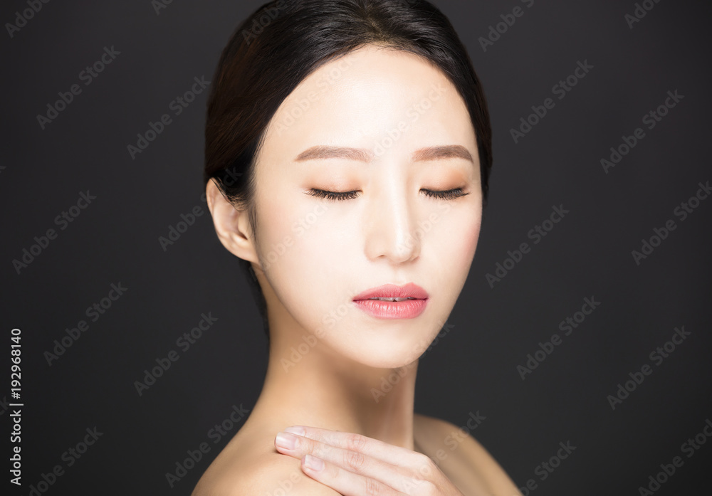 closeup asian beauty face isolated on black background closeup asian beauty face isolated on black background