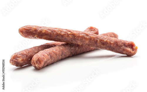 Three Hungarian dry sausages pepperoni isolated on white background smoked in natural casing mixed pork beef.