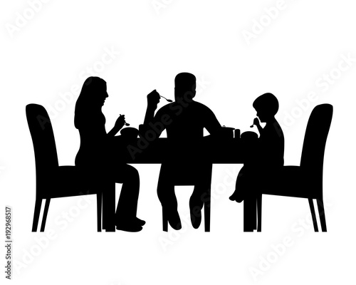 Silhouette of a home scene were a family enjoy their lunch or dinner, one in the series of similar images