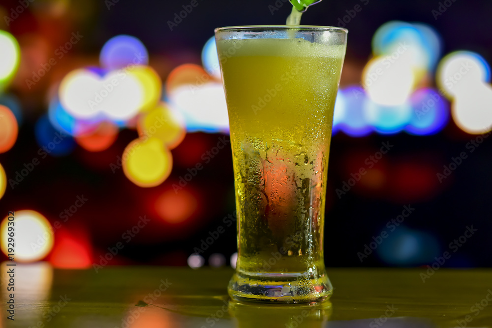 A glass of drink with bokeh background A glass of drink with bokeh background