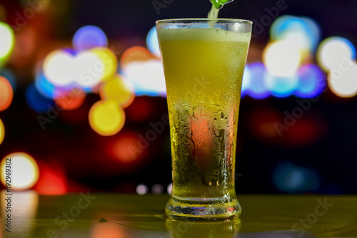 A glass of drink with bokeh background