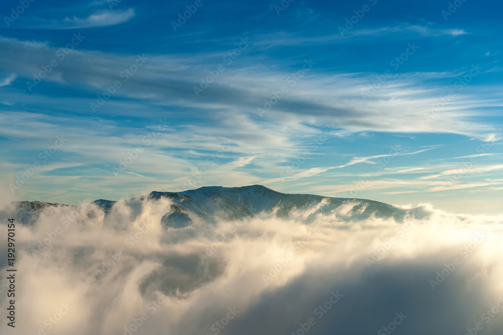 Winter mountain landscape with fog