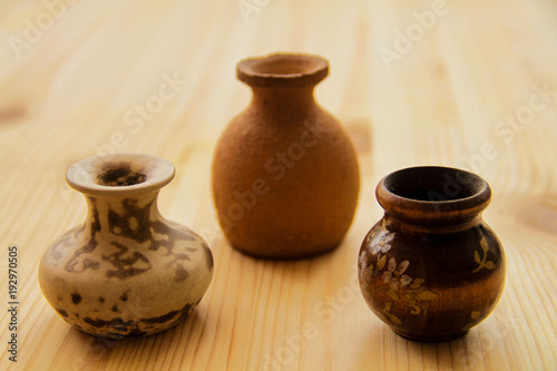 a collection of earthenware jugs
