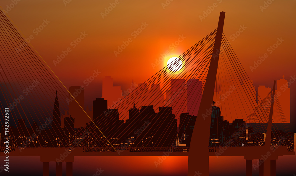 Obraz premium large bridge and modern buildings at orange sunset