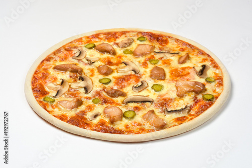 Pizza with chicken, gherkins and cheese on a white background