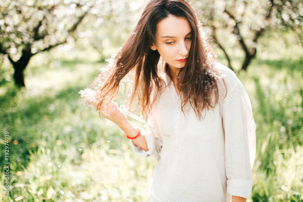 Spring is in the air. Nature ressurection after long sleep. Tender woman portrait in Japanese blooming emerald garden. Femininity of smiling happy cute girl with unusual lifestyle activity outdoor. Spring is in the air. Nature ressurection after long sleep. Tender woman portrait in Japanese blooming emerald garden. Femininity of smiling happy cute girl with unusual lifestyle activity outdoor.