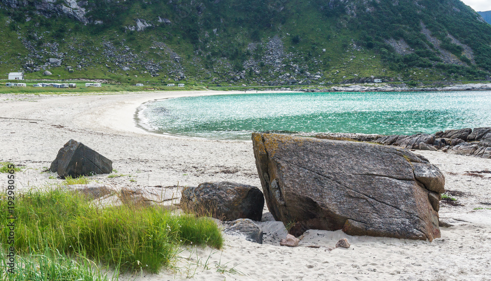 Rocky shore, sandy beach with turquoise water, Lofoten, Norway