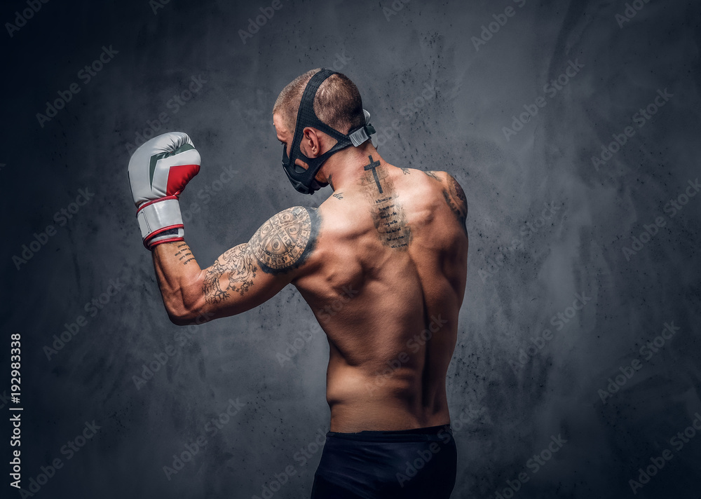 Fighter male over grey vignette background.