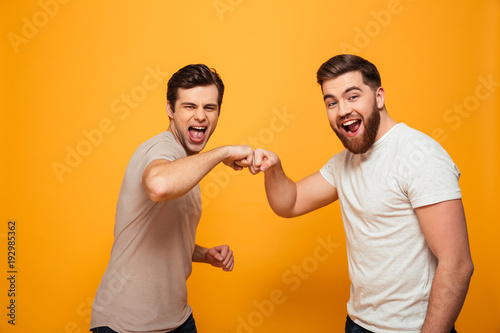 Portrait of a two joyful young men photo
