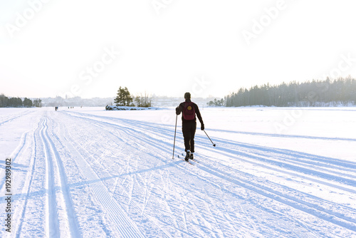 Female skier skiing on the ice of Lake Saimaa, Lappeenranta, Finland