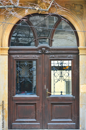 Wooden and metal ancient design door. Decoration, texture, close up