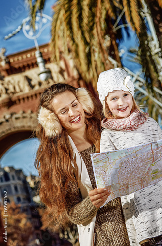 mother and daughter near Arc de Triomf looking at map photo