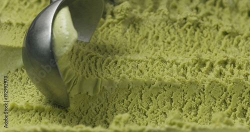 closeup matcha ice cream scooping