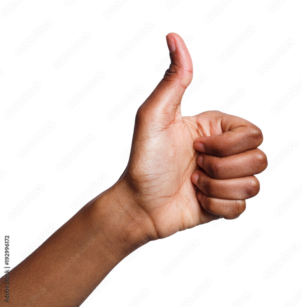 African-american hand making thumb up gesture African-american hand making thumb up gesture