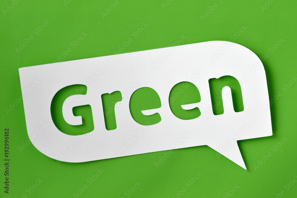 Green text cut-out on comic bubble over green background