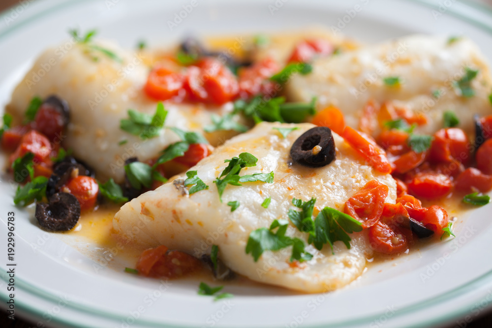 Fish fillet with cherry tomatoes and olives Fish fillet with cherry tomatoes and olives