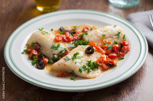 Fish fillet with cherry tomatoes and olives