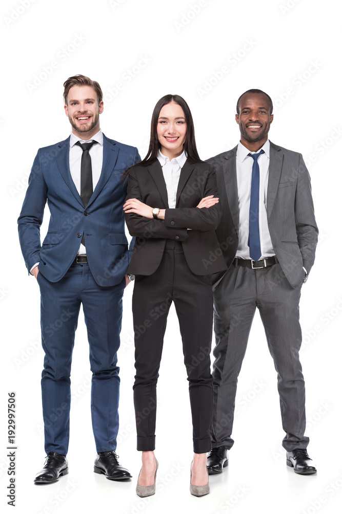 smiling multicultural young business people in suits isolated on white smiling multicultural young business people in suits isolated on white