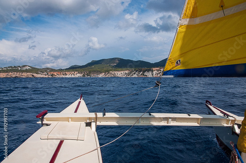 Going Sailing on a catamaran with yellow sails in Ibiza