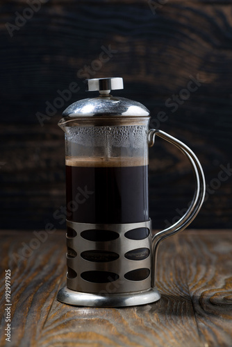 freshly brewed coffee in the french press, vertical