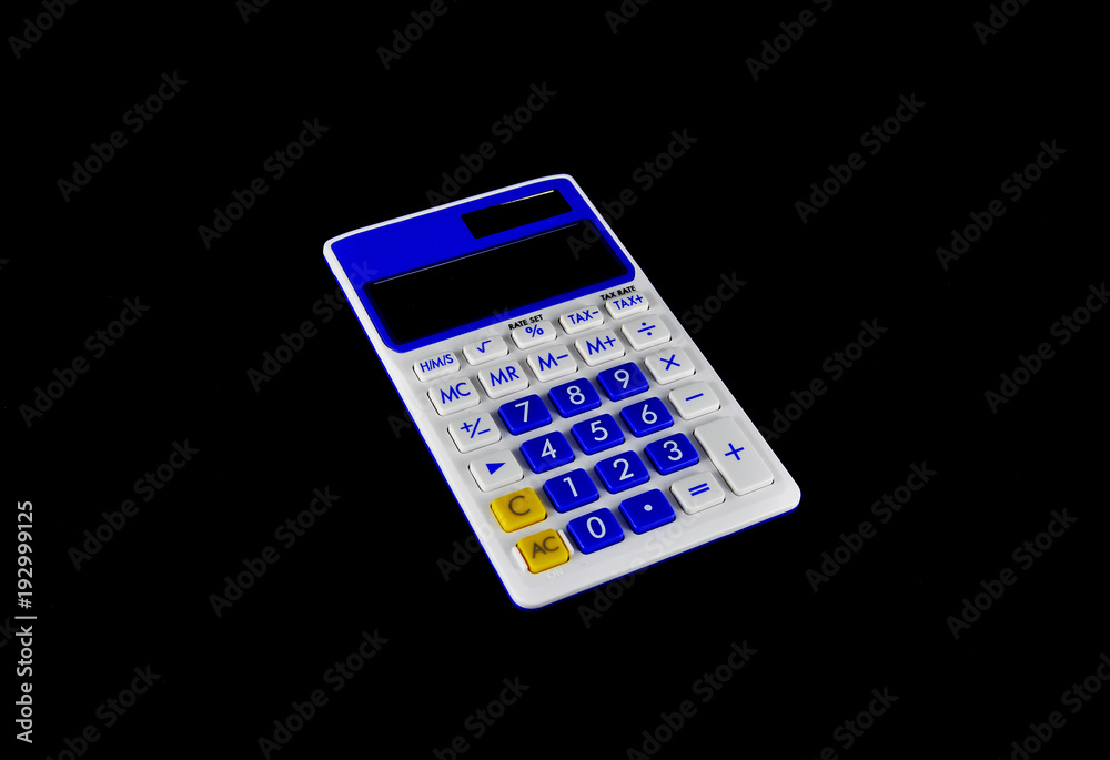 Calculator on black background close up. Business, electronics, office Calculator on black background close up. Business, electronics, office