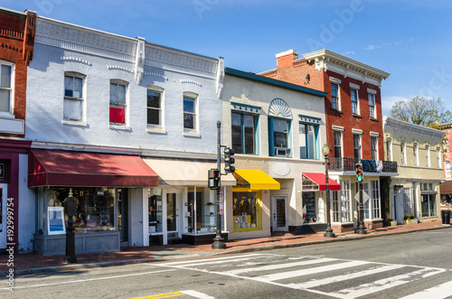 Traditional Old American Buildings with Colourful Shops along a Brick Sidewalk on a Clear Autumn Day photo