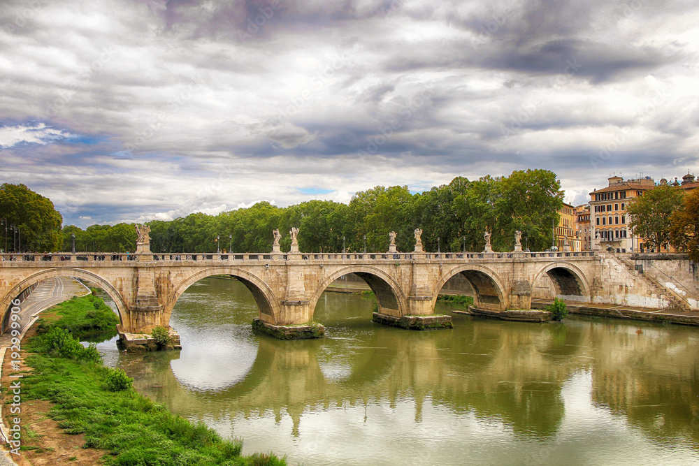 Ponte Sant'Angelo on the background of a beautiful cloudy sky. Italy Rome