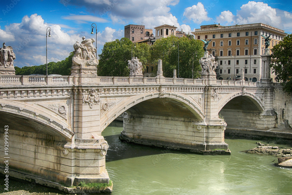Ponte Vittorio Emanuele II against a bright blue sky. Italy Rome