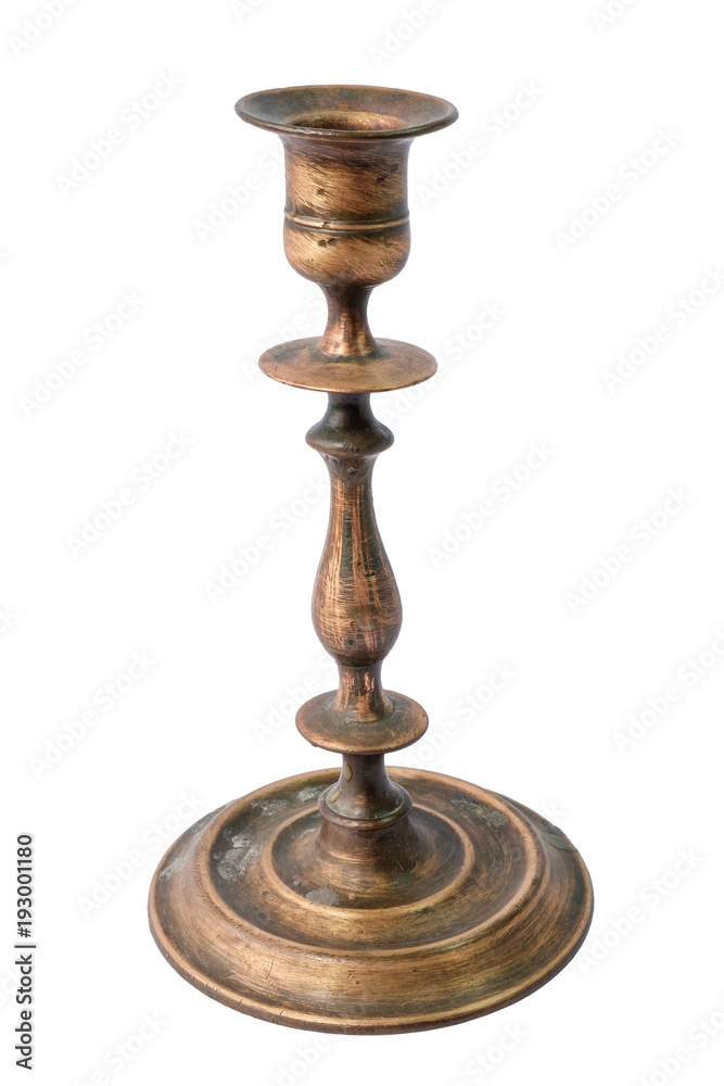 An old vintage metal bronze candlestick rustic on a white background, isolated