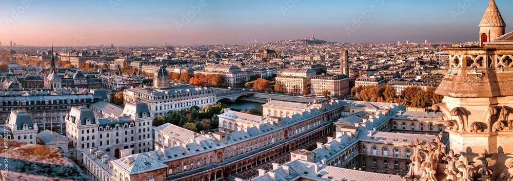 Aerial panorama at sunset of Paris,France, with Seine river and autumn colors.